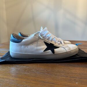 White and Black low-top Golden Goose sneakers